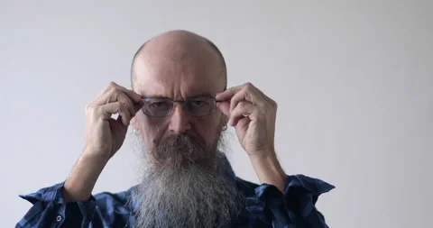 Man with beard and glases looking at camera Stock Footage 168194267