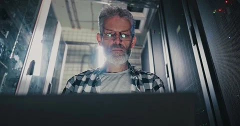 Man With Beard and Glasses Working on Laptop Stock Footage 275570708