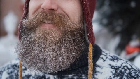 Man with beard and mustache blows snow,concept of Christmas and new year Stock Footage 127555220