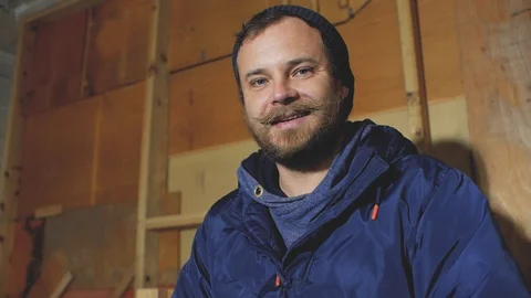 Man with beard and mustache smiles and makes like Stock Footage 102941866