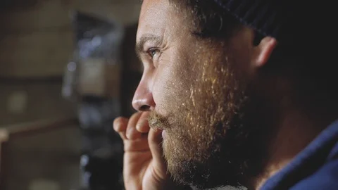 A man with a beard and mustache straightens his mustache and smiles Stock Footage 102768330