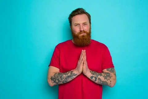 Man with beard asks to be forgiven and prays Stock Photos