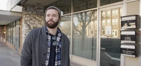 Man with a Beard in Beanie Walking Forward Stock Footage 87102690