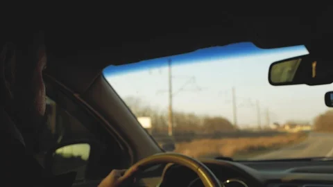A man with a beard is carefully driving. back view Stock Footage 103569306