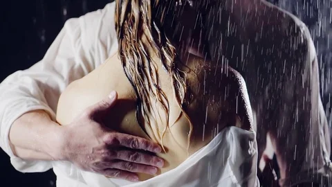 Man with a beard caressing hand on the bare back of his woman. they wet standing 스톡 동영상 78706582