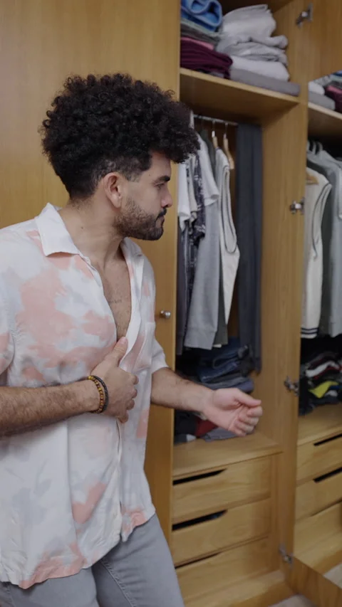 Man with beard dancing in front of mirror at home Stock Footage 264915531