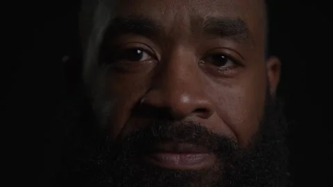Man With Beard In Dark Room Looking Stock Footage 270397199