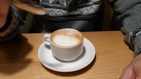 A man with a beard drinking coffee in a cafe 스톡 동영상 122030536