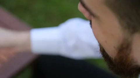 Man with a beard drinks coffee Stock Footage 64861402