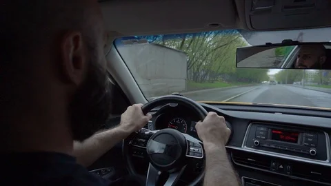 A man with a beard driving Stock Footage 129968247