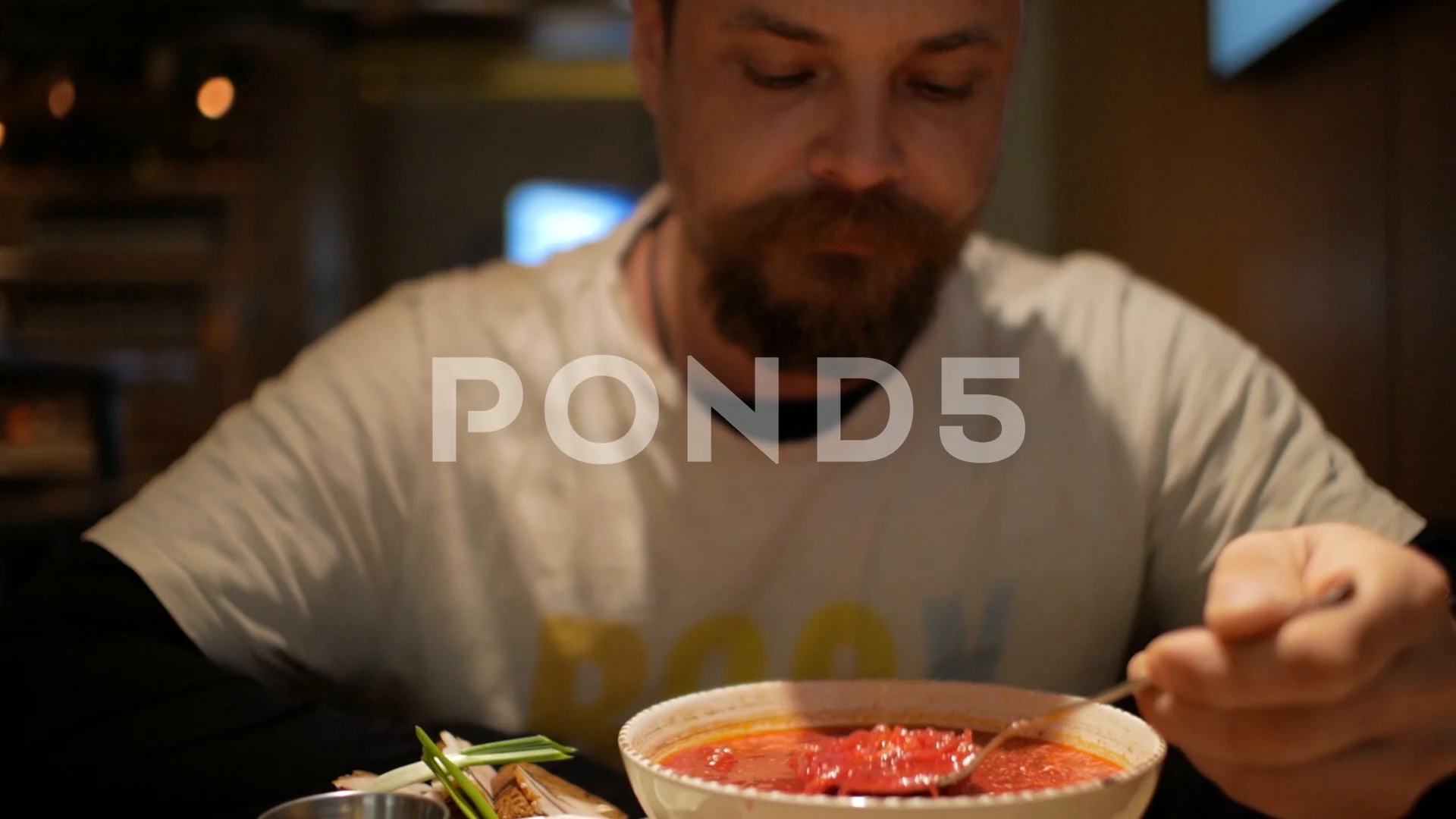 man with a beard eating borsch with sour... | Stock Video | Pond5