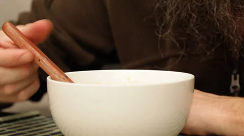 Man with beard eating soup; close up;  Stock Footage 35920725