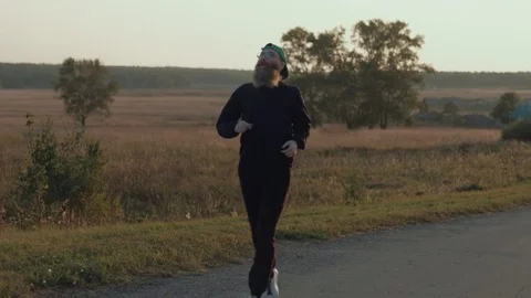 The man with a beard on an evening jog. Stock Footage 81647275