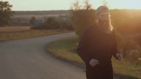 The man with a beard on an evening jog. Stock-Footage 81794123