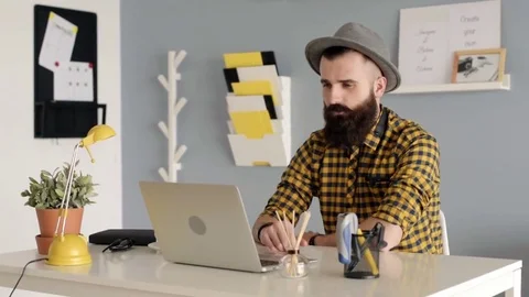 Man with beard having conversation on the laptop Video stock 72524125