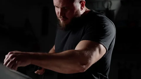A man with a beard is holding a tool in his hand Stock Footage 269208863