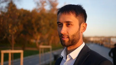 A man with a beard in a jacket is smiling. HD, 1920x1080, slow motion Stock Footage 117426975