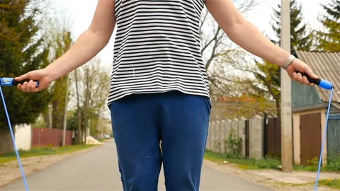 A man with a beard jumping on a rope. Slow motion Stock Footage 88910793