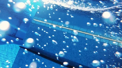 Man with beard jumps into pool surrounded by palm trees, camera in hand. Runs up Vídeo Stock 156743388