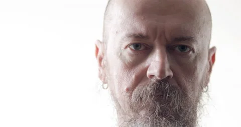 Man with beard looks towards camera Stock Footage 168199139