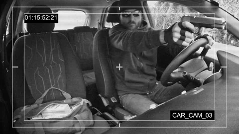 A man with a beard opens shooting from a moving car. CCTV concept 스톡 동영상 98916418