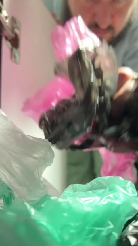 Man with beard out of focus takes out bag from closet Stock Footage 303779853
