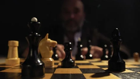 Man with a Beard playing in a Game of Chess at a Bar Stock Footage 138048855