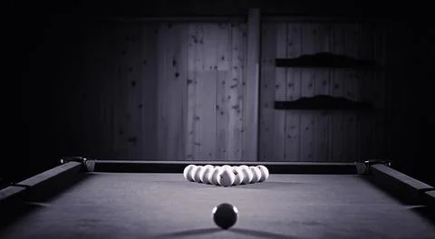 A man with a beard plays a big billiard. Party in a 12-foot pool. Billiards.. Stock Photos