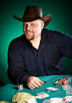 Man with a beard plays poker Stock Photos