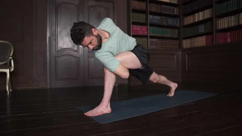 Man with beard Practice Yoga Pose At Home. Attractive Man Making Yoga Pose. Stock Footage 152570880