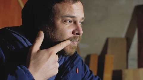 A man with a beard puts wax on his mustache Stock Footage 102768072