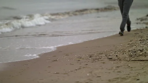 Man with Beard Running by the Beach at Dusk - Close Up Shot Stock Footage 130728406