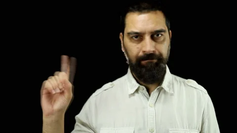 Man with beard saying no by waving his finger over black background. Stock Footage 157779461