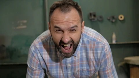 A man with a beard screams Stock Footage 99578355