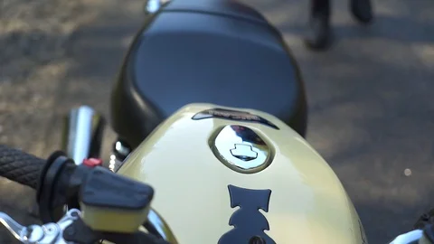 A man with a beard sits on his motorcycle Video stock 88499909