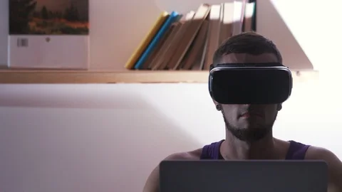 Man with beard sitting at desktop and testing new application. Guy looking Video stock 98181410