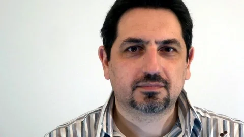 A man with a beard is smiling at the camera 動画素材 93098116