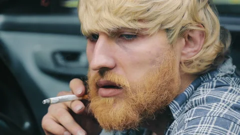 A Man With A Beard Smokes In A Car. Close-up Of Smoking In A Standing Car Stock Footage 229559092