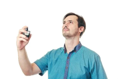 The man with a beard splashes to smell 스톡 사진