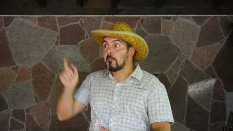 A man with a beard takes off his hat and greets others. 4K Stock-Footage 115557984