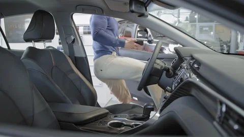 Man with beard taking self portrait inside new car. Stock Footage 99773430