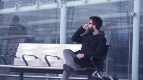 Man with Beard talk at telephone outside airport Stock Footage 74167295