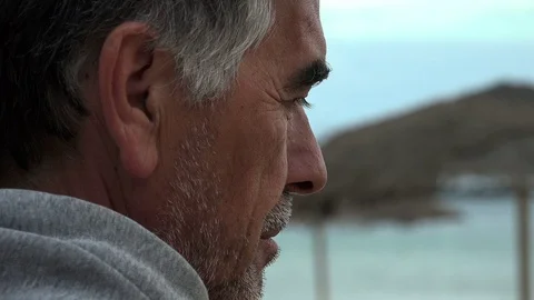 Man with beard thoughtfully observes the sky Stock Footage 71937544