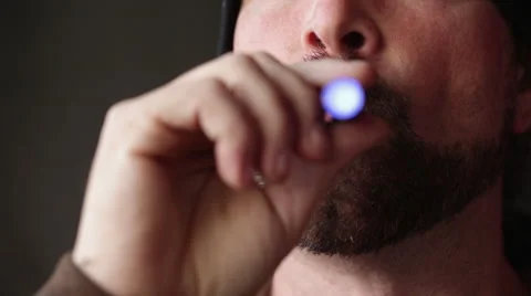 Man with Beard Vapes Smokes an E-Cigarette - Close Up Jaw Stock Footage 46062044