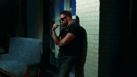 Man with beard vaping an electronic cigarette. Stock Footage 72666919