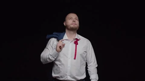 A man with a beard in a white shirt with a jacket on his shoulder Stock Footage 194120330