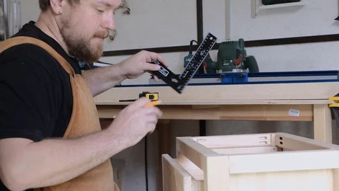 A man with a beard works in his workshop. Profession carpenter. A man works with Stock Footage 113994849