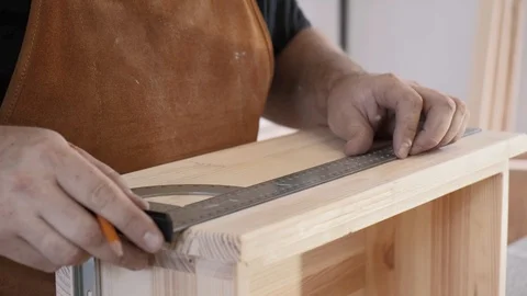 A man with a beard works in his workshop. Profession carpenter. A man works with Stock Footage 113995404