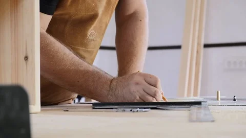 A man with a beard works in his workshop. Profession carpenter. A man works with Stock Footage 113996343
