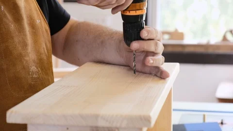 A man with a beard works in his workshop. Profession carpenter. A man works with Stock Footage 113996514